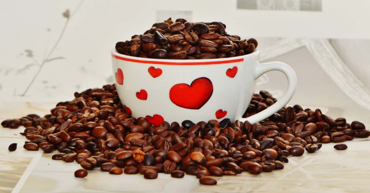 Coffee Party USA - next Steps Photo of coffee cup overflowing with coffee beans and decorated with hearts.