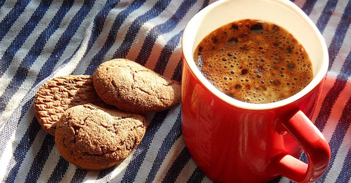 Privacy and Cookies (photo of red cup of coffee with cookies on a white and blue striped table cloth) - Coffee Party USA.